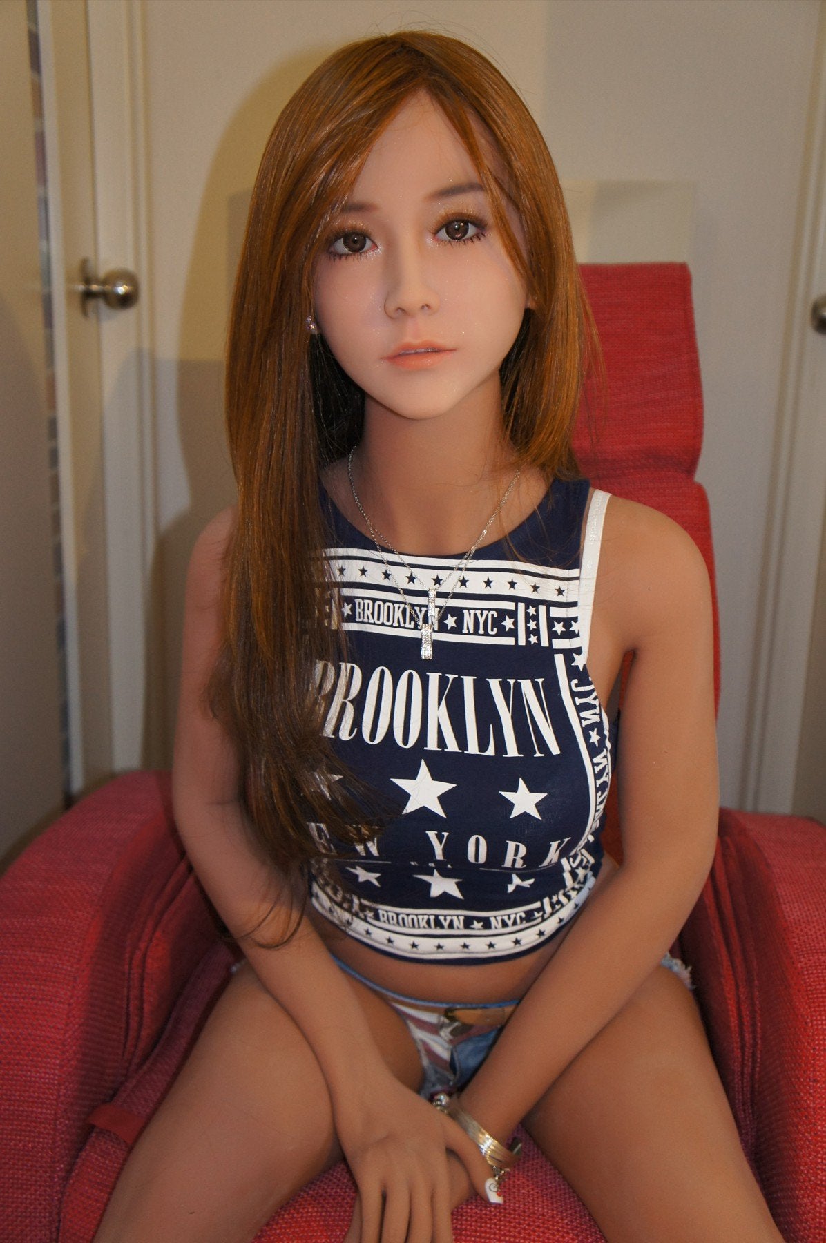 A doll with a slim body, perky hips, and plump breasts and buttocks, as well as a face-thinning realistic doll